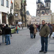 Picture of professor Scott Frish standing in street filled with people.